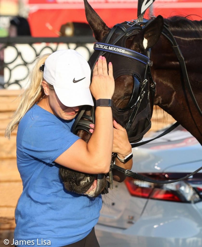 Tactical Mounds and trainer Megan Scran in the winners circle at The Meadowlands on July 13, 2024. James Lisa Photo.